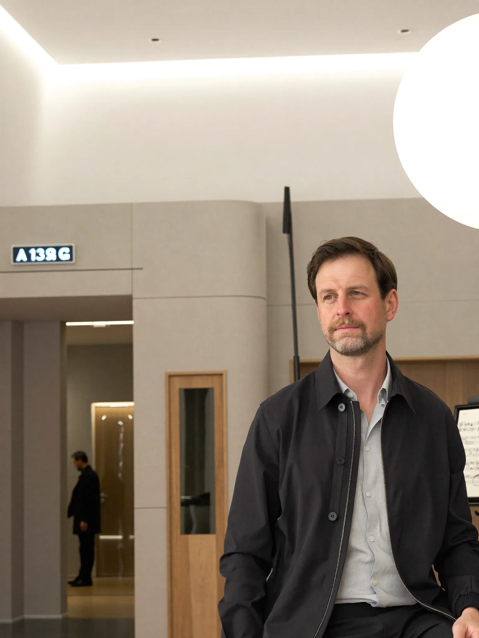 Moritz Winker standing in a modern interior